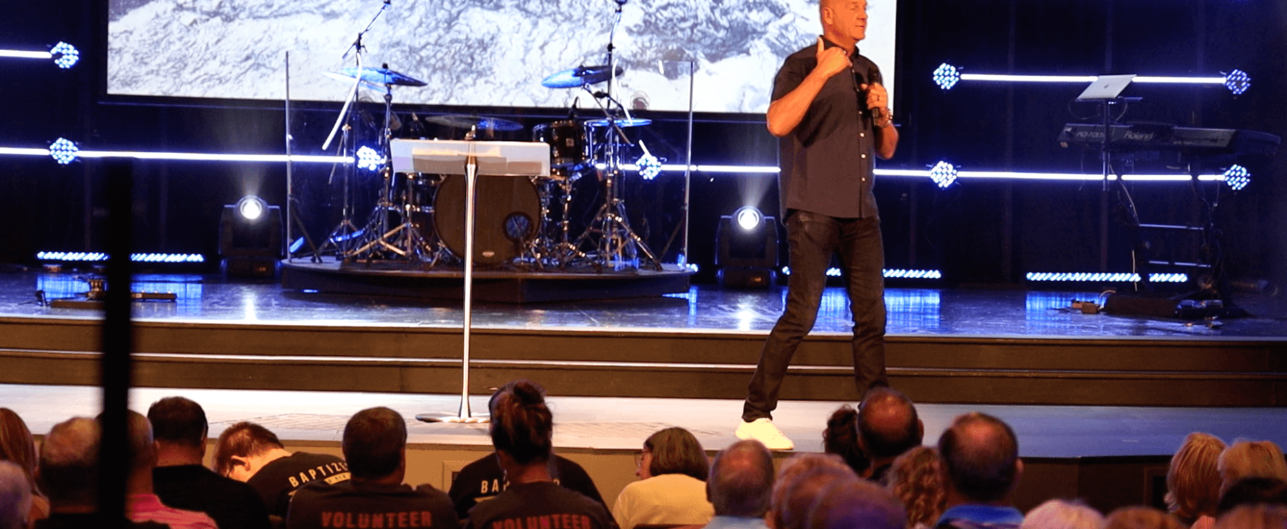 Pastor preaching on stage